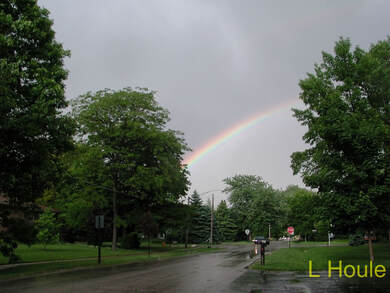 Rainbow photo I took watermarked with my name in the right hand corner